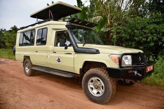 The Adventure Committee on safari in a Toyota Land Cruiser, Uganda