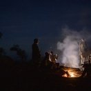 Camping around the fire at the kraal, Karamoja, Uganda