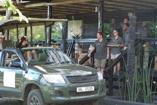 Makakatana Bay Lodge staff exitedly waiting for guest's return after a lovely safari