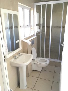 Bathroom with basin, toilet and shower