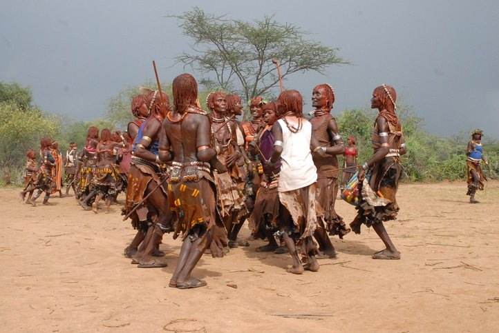 Hamer Tribes-Families of the Bull jumper dancing during the ceremony