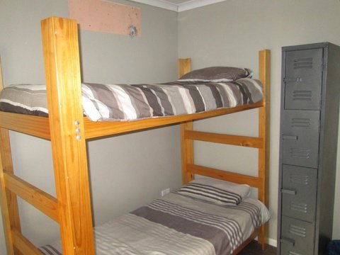 Bedroom with 4 wooden bunk beds 