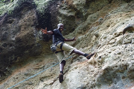Rock climbing at Sipi Falls waterfalls, Uganda