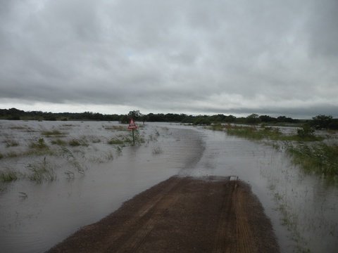 The Mpate River that feeds Lake St Lucia in Flood over the road on the way to Makakatana Bay Lodge