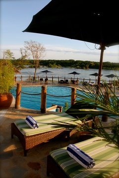 Swimming pool and sun lounger with river Nile view, Chobe Safari Lodge, Uganda