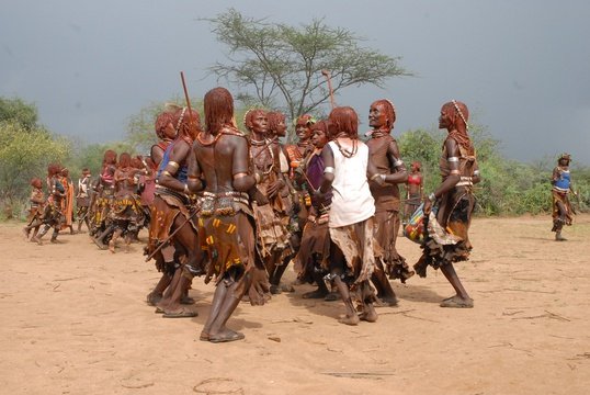 Hamer Tribes-Families of the Bull jumper dancing during the ceremony