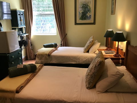 Twin Rooms at Knysna Manor House — comfortable, affordable accommodation with en-suite bathrooms and classic heritage charm. Twin Rooms at Knysna Manor House — comfortable, affordable accommodation with en-suite bathrooms and classic heritage charm.