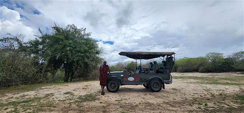 Maresu and our vehicle at Lake Mzizima.