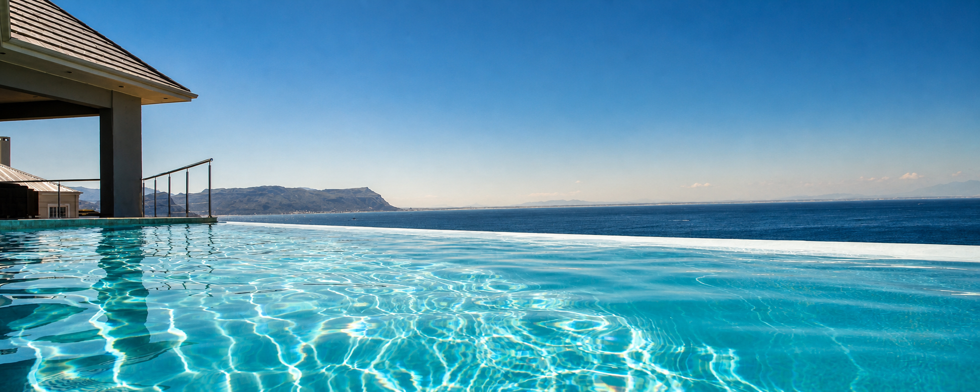 Infinity swimming pool overlooking False Bay at Aqua Terra Boutique Guesthouse in Simon's Town, Cape Town