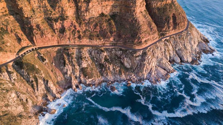 Aerial view of Chapman's Peak Drive cut into steep coastal cliffs