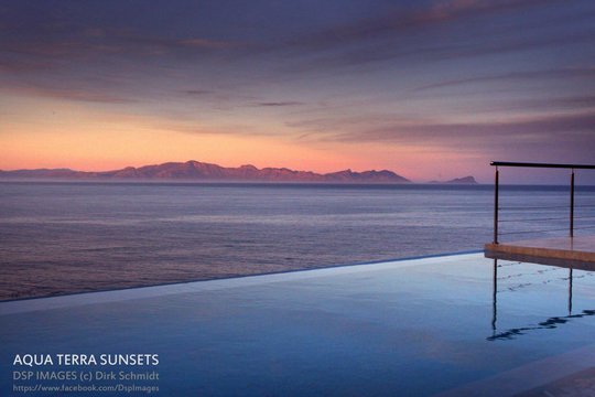 Aqua Terra infinity pool overlooking False Bay at sunset