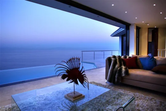 Covered Aqua Terra terrace overlooking the ocean at dusk