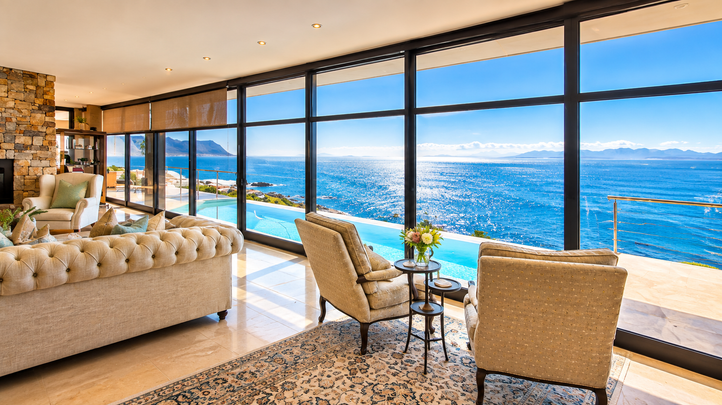 Aqua Terra lounge seating beside floor-to-ceiling windows overlooking False Bay