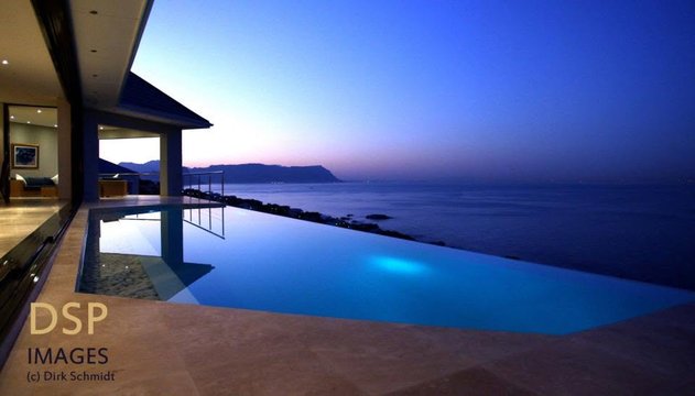 Aqua Terra infinity pool overlooking False Bay at dusk