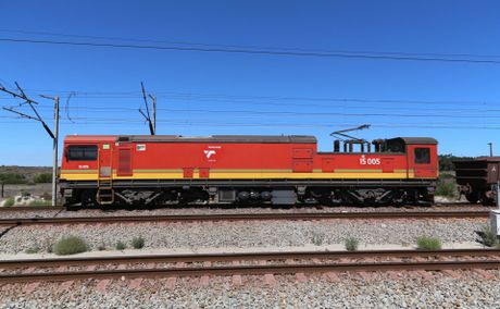 Archive red Transnet Class 15E locomotive on the Sishen-Saldanha railway line, photographed in February 2015