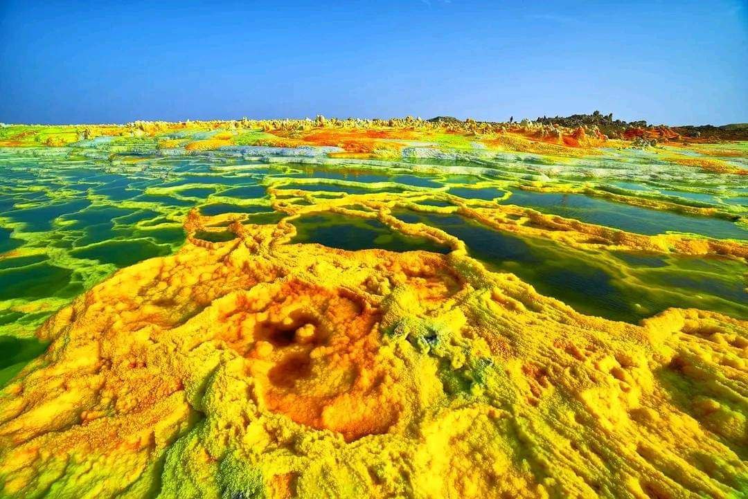 Discover the world of photography with Authentic Ethiopia Tours on a photographing tour of Dallol Depression. Capture vibrant mineral formations, sulfuric springs, and salt flats – one of the lowest points on Earth – in a stunning, surreal landscape. This tour is a dream for every photographer, offering unparalleled opportunities to capture Ethiopia’s extreme natural beauty