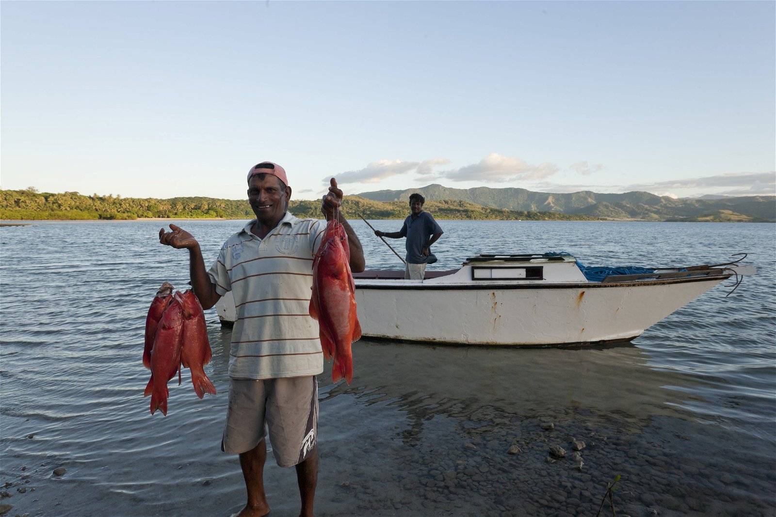 Local Fijian fishermen bringing in the day’s catch near Dolphin Island