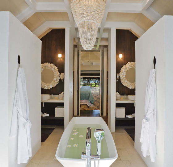 Luxury bathroom with double vanity and tropical design at Dolphin Island