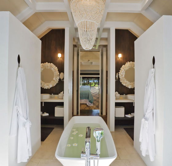 Luxury bathroom with double vanity and tropical design at Dolphin Island