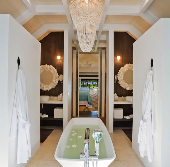 Luxury bathroom with double vanity and tropical design at Dolphin Island