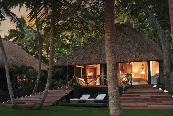 Thatched-roof guest bure by the beach at Dolphin Island Thatched-roof guest bure by the beach at Dolphin Island