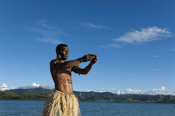 Local host presenting a kava ceremony at Dolphin Island