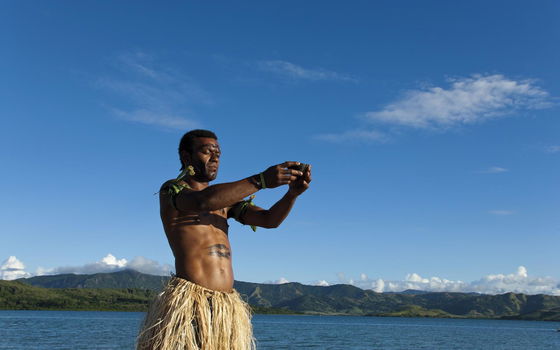 Fijian host performing a traditional kava ceremony at Dolphin Island