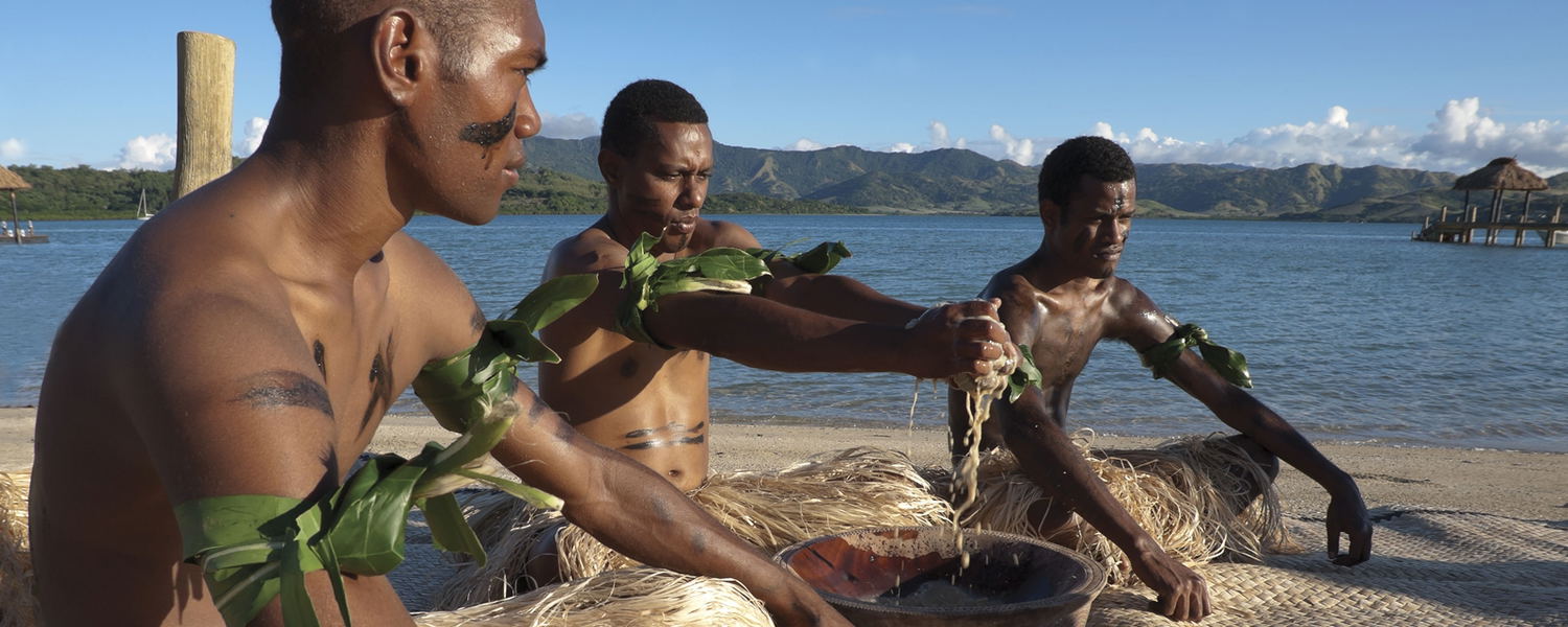 Guests participating in a traditional kava ceremony at Dolphin Island