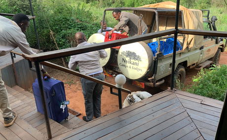 Guests' delayed bags being delivered to camp. (Guest's photo.) Guests' delayed bags being delivered to camp. (Guest's photo.)