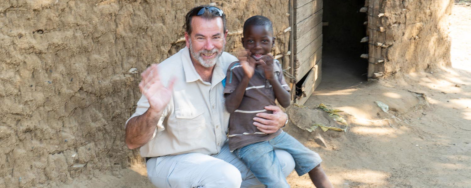 Neville Jones with an enthusiastic villager in Botswana