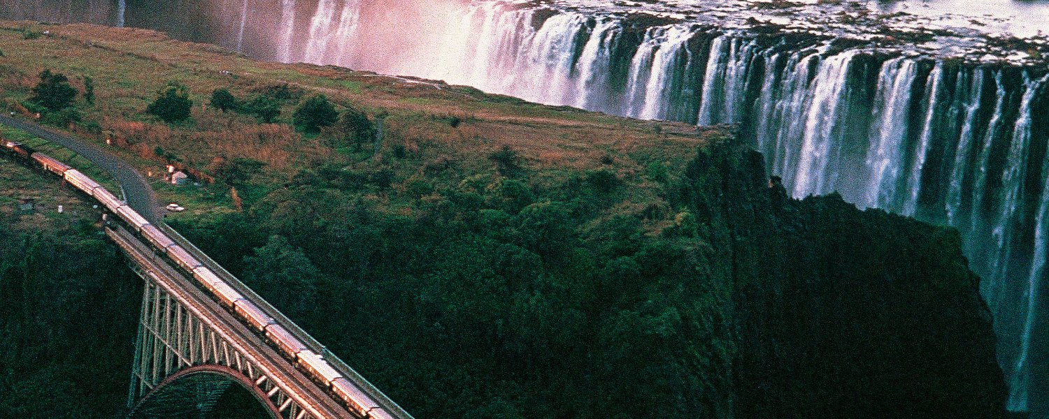 Victoria Falls and train on bridge