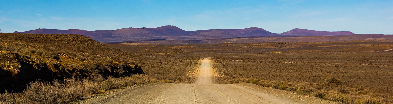 Karoo road. Photo by Juanita Swart on Unsplash juanita-swart-SxI8zWKqlek-unsplash