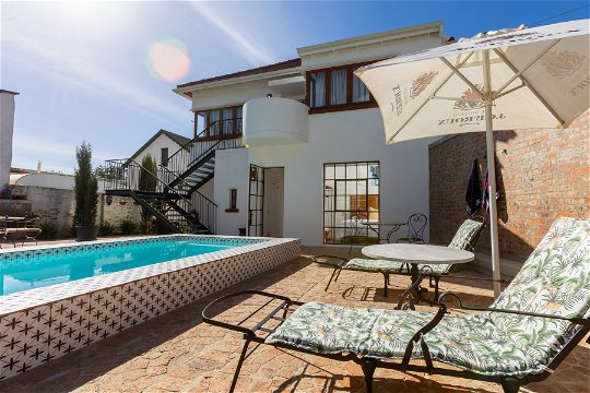 Private courtyard with 8meter lap pool and BBQ facility for outside dining at La Maison On Main in Paarl.