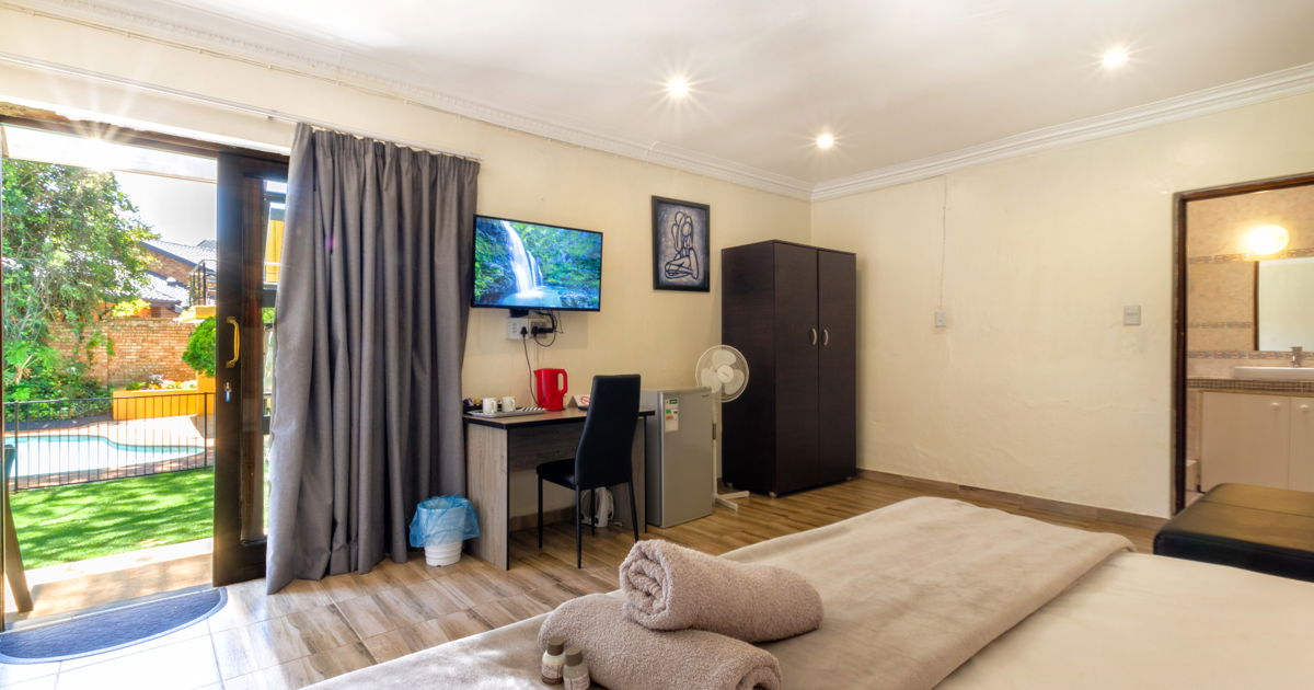 One of our beautiful room watching the pool and garden 