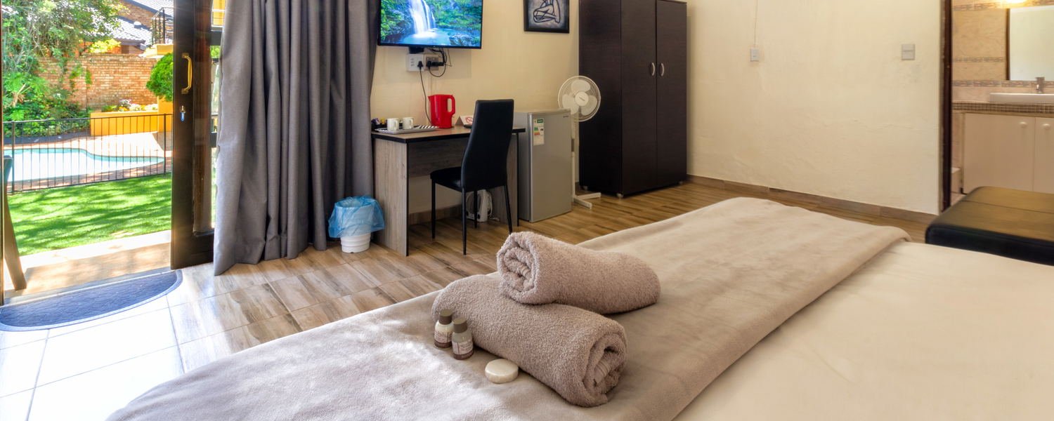 One of our beautiful room watching the pool and garden 