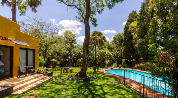 Lush gardens and beautifully landscaped outdoor space at a guesthouse, providing a peaceful escape for guests to relax and unwind at Linden Guesthouse 