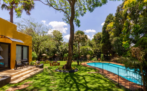 Lush gardens and beautifully landscaped outdoor space at a guesthouse, providing a peaceful escape for guests to relax and unwind at Linden Guesthouse 