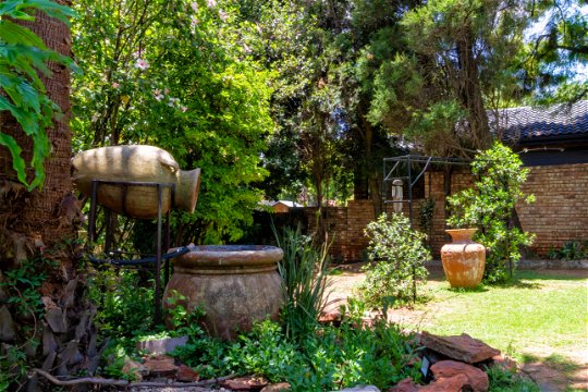 Lush gardens and beautifully landscaped outdoor space at a guesthouse, providing a peaceful escape for guests to relax and unwind at Linden Guesthouse 