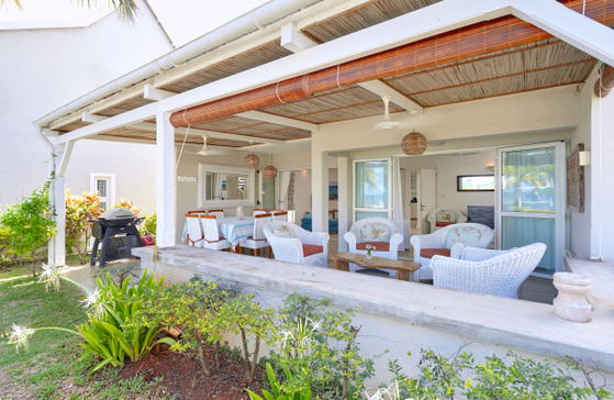 Villa patio with seating area, views of the ocean and pool, outside dinning area