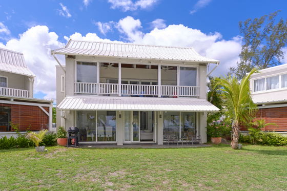 White Oaks Villa exterior with ocean-facing lawn and patio