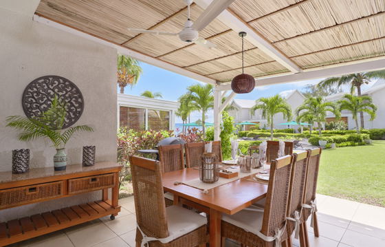 Outside dinning area with sea views and a modern touch