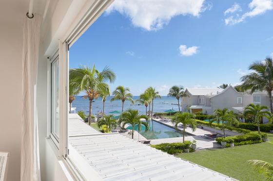View from the bedroom window, ocean and pool views