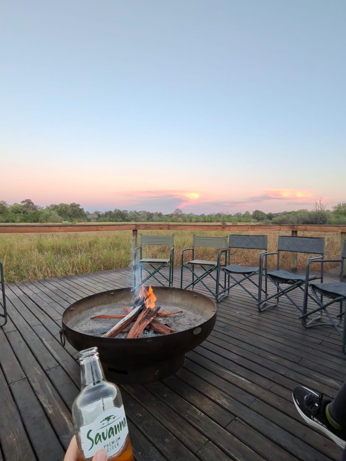Sunset, fireside chat, and a safari sundowner drink