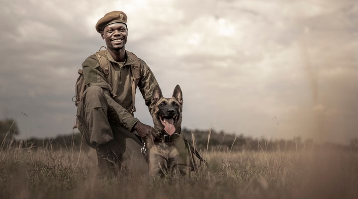 Grumeti Game Reserve. Anti-poaching K9 handler in the field. © Singita
