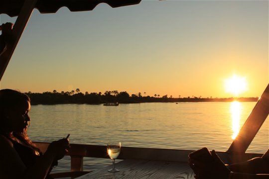 Sundowner drinks on the Zambezi River.