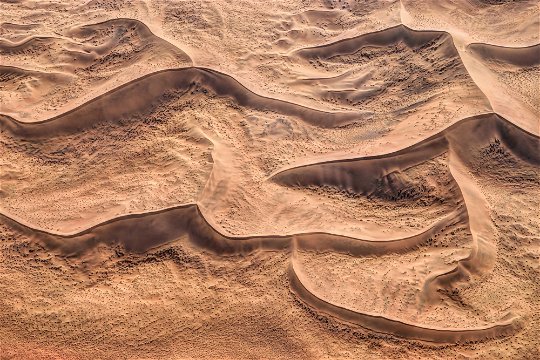 Stretches of dunes visible from the sky.