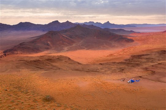 Scenic helicopter flight and picnic setup at &Beyond Sossusvlei © &Beyond