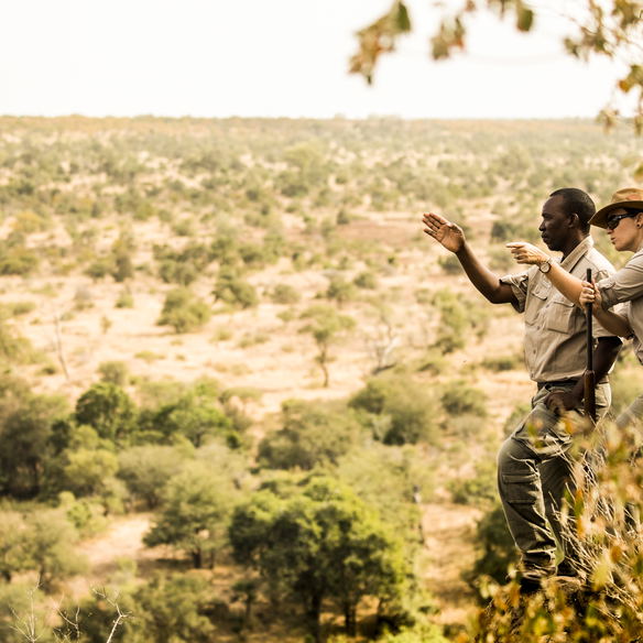 Walking safari at Singita Sweni with Margaux and tracker Lawrence. © Singita