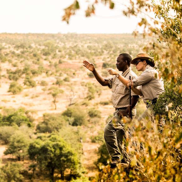 Walking safari at Singita Sweni with Margaux and tracker Lawrence. © Singita