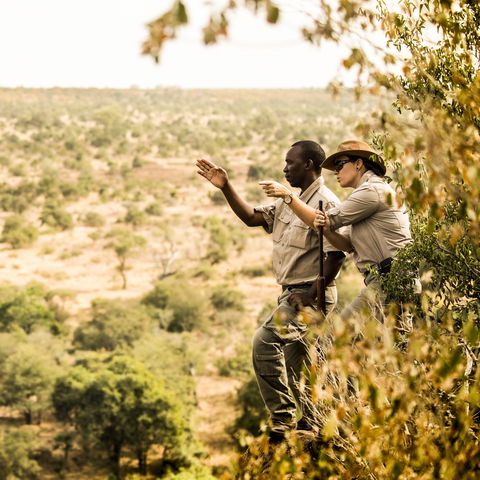 Walking safari at Singita Sweni with Margaux and tracker Lawrence. © Singita